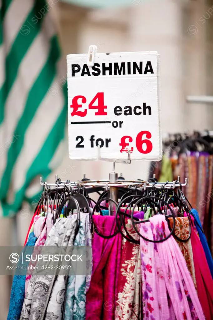 England, London, Oxford Street. Pashminas for sale from a street stall on Oxford Street.