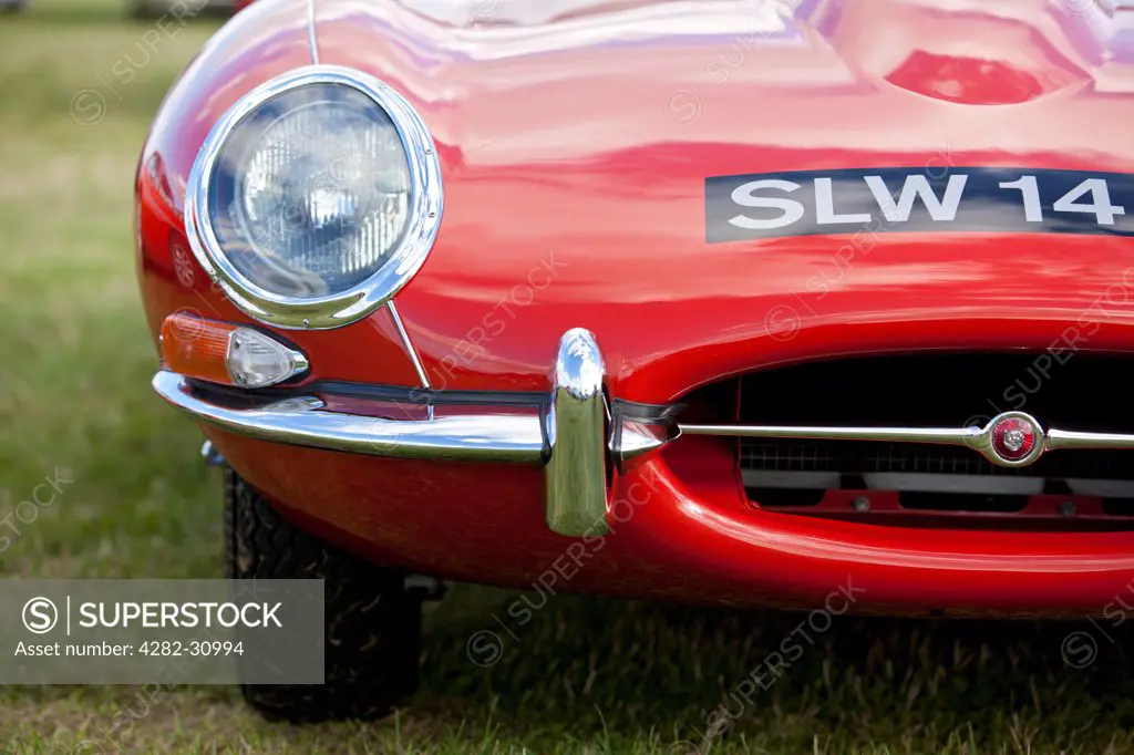 England, West Sussex, Goodwood. A close up view of a Jaguar E Type classic car at Goodwood revival.