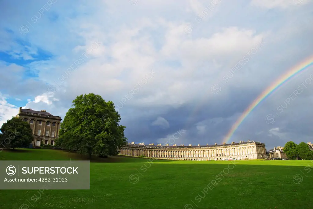 England, Bath and North East Somerset, Bath. A view of the Royal Crescent in Bath with a rainbow overhead.