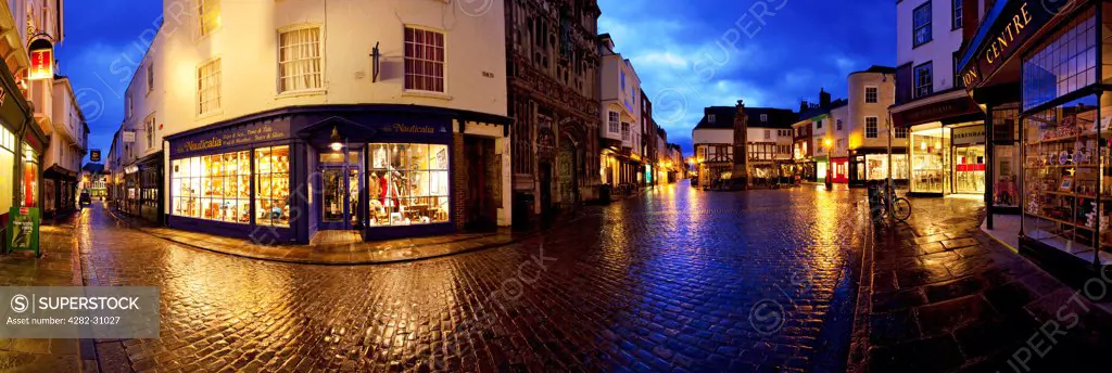 England, Kent, Canterbury. A view of the Buttermarket in Canterbury city centre at dusk.