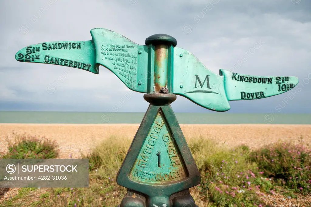 England, Kent, Deal. An iron sign post marking the directions along the coastal path between Dover and Canterbury in Deal.