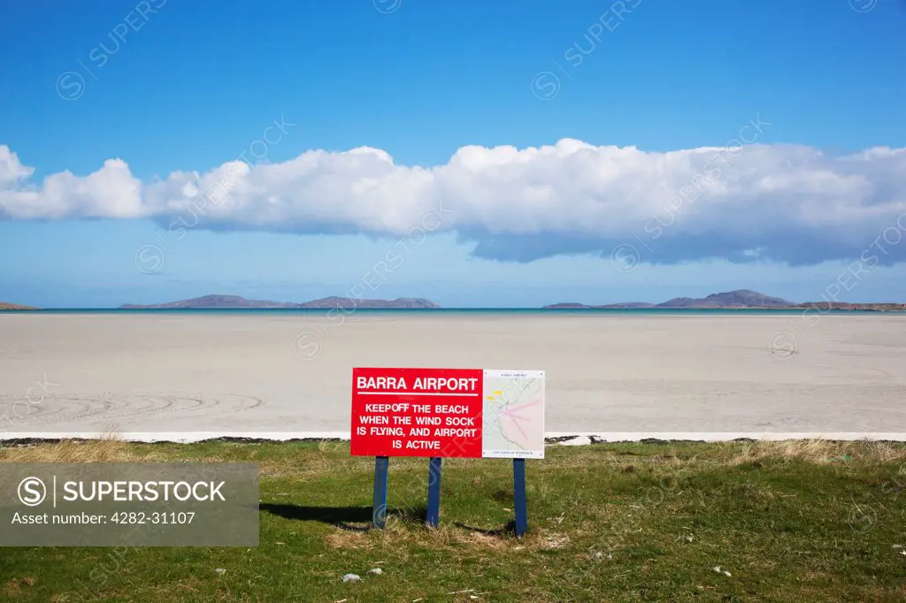 Scotland, Outer Hebrides, Barra. View of Barra Airport sign and Traigh Mhor beach which is used as the runway.