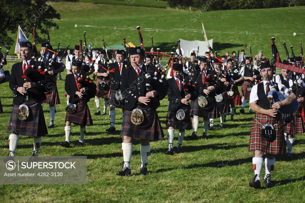 Scotland, Scottish Borders, Bowhill House. A pipe band performing at The Muster, a regional gathering of Lowland and Border Clans on Buccleuch Estate, Selkirk.
