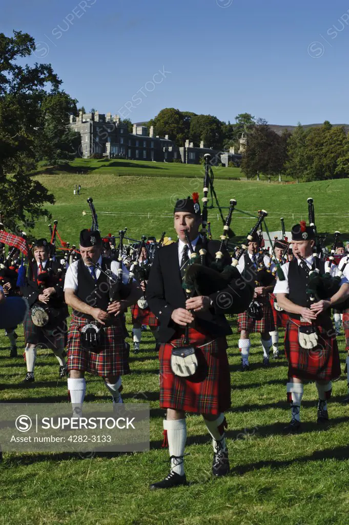 Scotland, Scottish Borders, Bowhill House. A pipe band performing at The Muster, a regional gathering of Lowland and Border Clans on Buccleuch Estate, Selkirk.