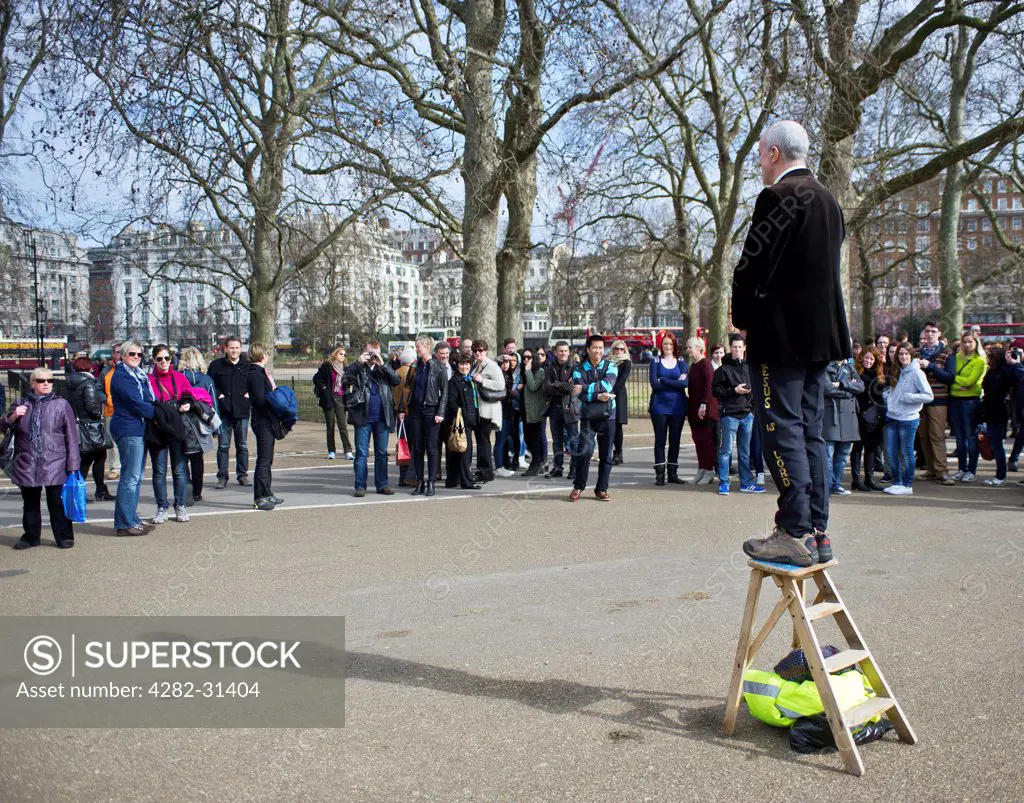 England, London, Hyde Park. A man standing on wooden stepladder at Speakers Corner in London.