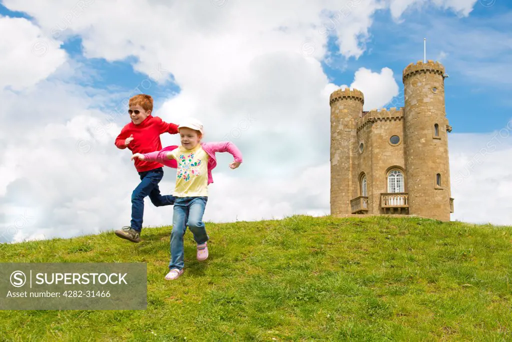 England, The Cotswolds, Broadway Hill. Children playing at Broadway Tower in The Cotswolds.