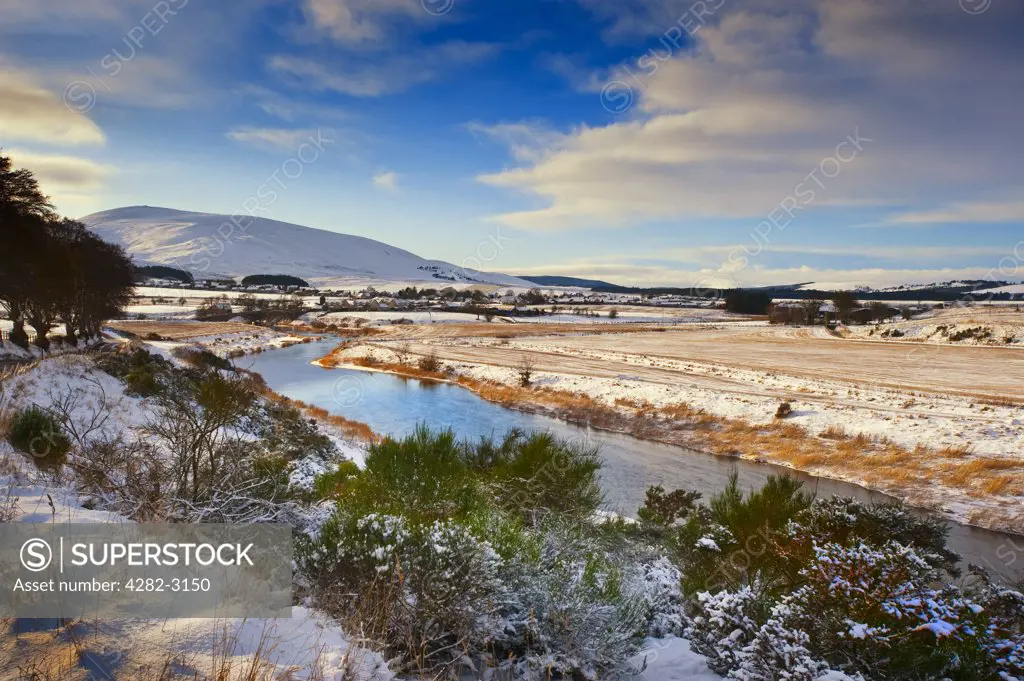 Scotland, South Lanarkshire, Thankerton. Winter landscape featuring Tinto Hill and the village of Thankerton.