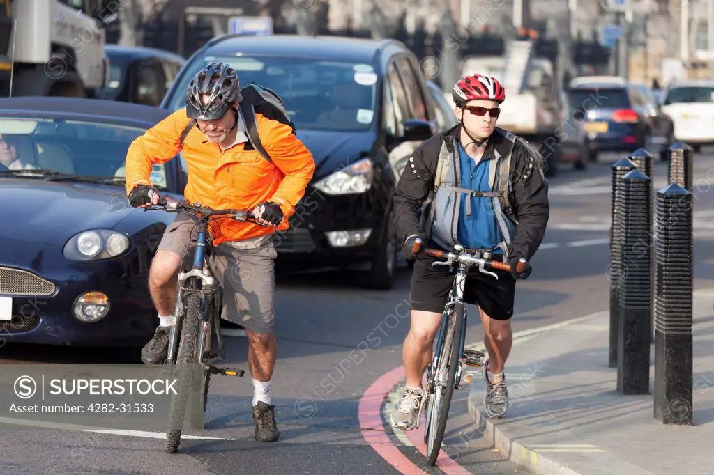 England, London, Victoria Embankment. Cyclists turning into Victoria  Embankment in London.