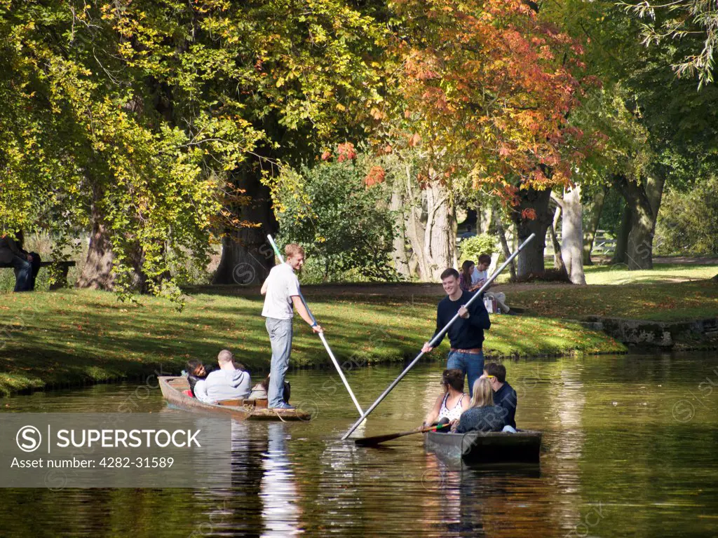 England, Oxfordshire, Oxford. Punting on the Cherwell at Oxford in early autumn.
