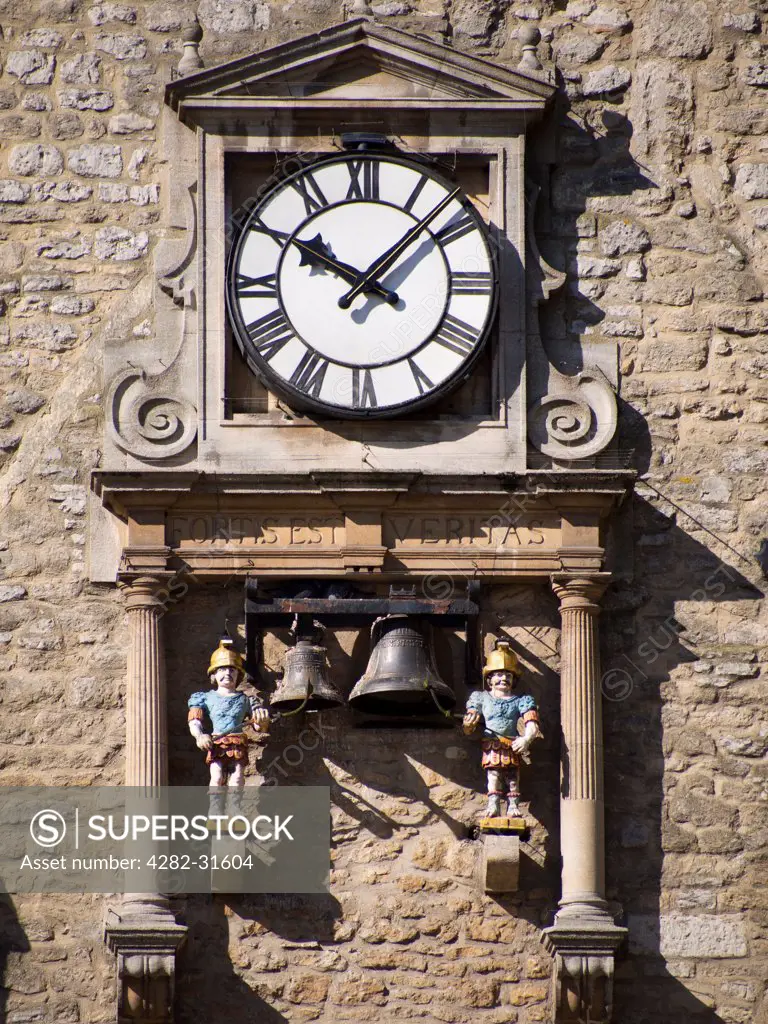 England, Oxfordshire, Oxford. A clock outside Carfax Tower in Oxford.