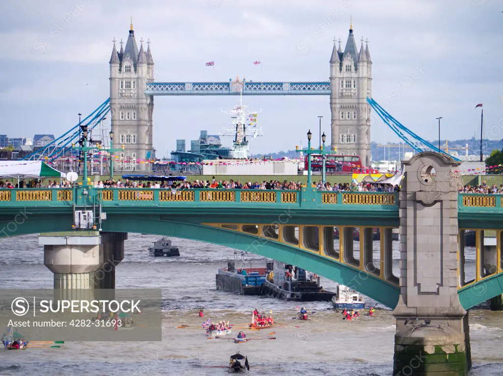 England, London, Southwark Bridge. A flotilla of small boats passing under Southwark Bridge during the Thames Festival.