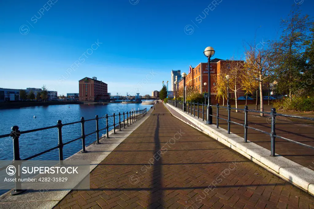 England, Greater Manchester, Salford Quays. Walkway alongside Ontario Basin located on the Salford Quays in the City of Salford in Greater Manchester.
