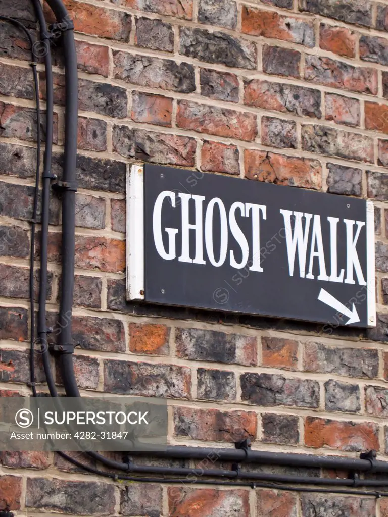 England, North Yorkshire, York. Ghost Walk starting point sign on a wall near the River Ouse.