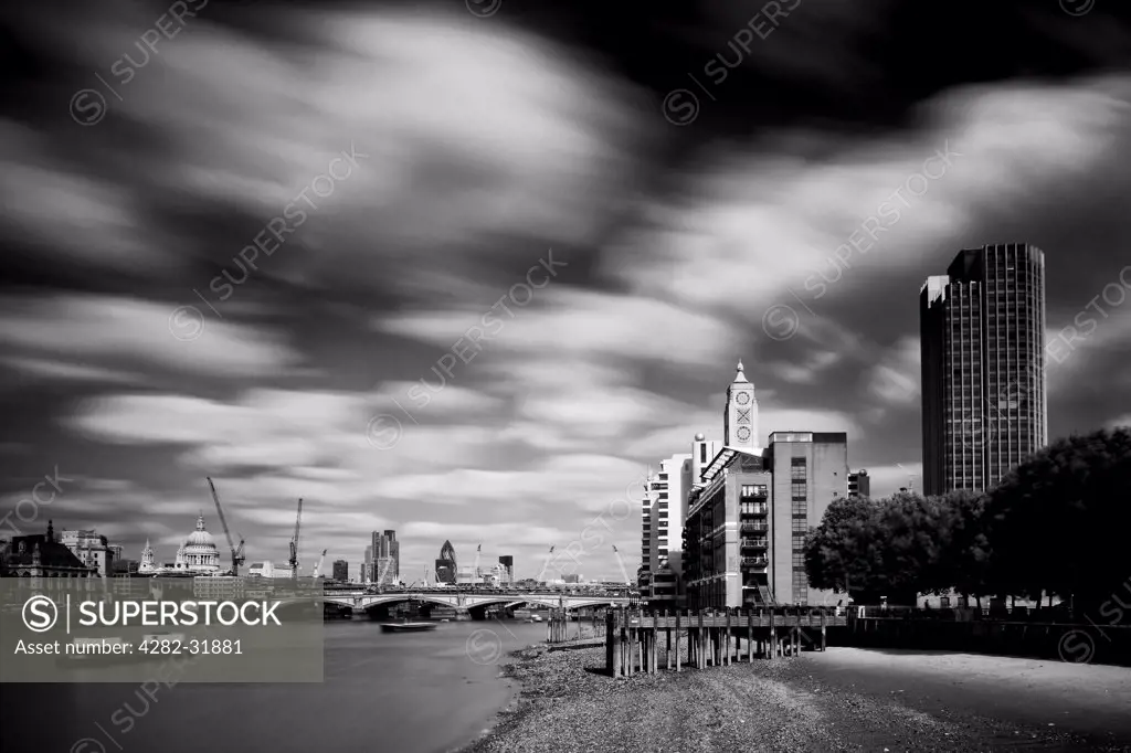 England, London, South Bank. The OXO Tower viewed from upstream of the River Thames with Sea Containers House and the City Of London and Gherkin building beyond.