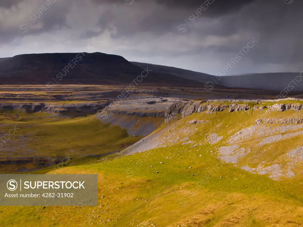 England, North Yorkshire, Yorkshire Dales National Park. Looking towards the peak of Ingleborough and the Moughton Scars.