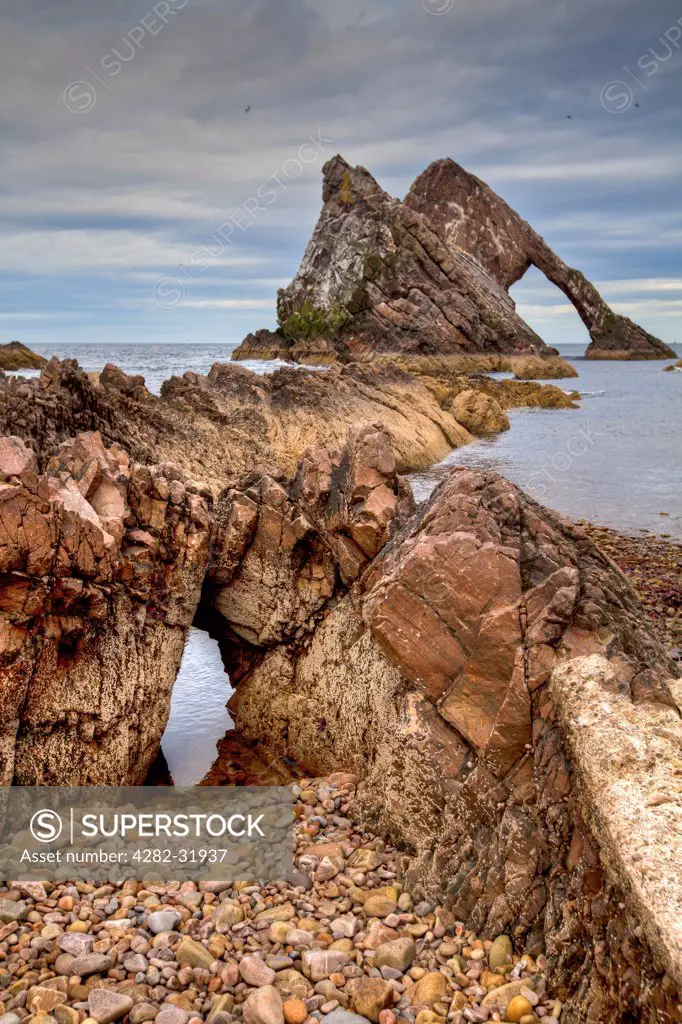 Scotland, Banffshire, Findochty. The Bow Fiddle Rock at Findochty.
