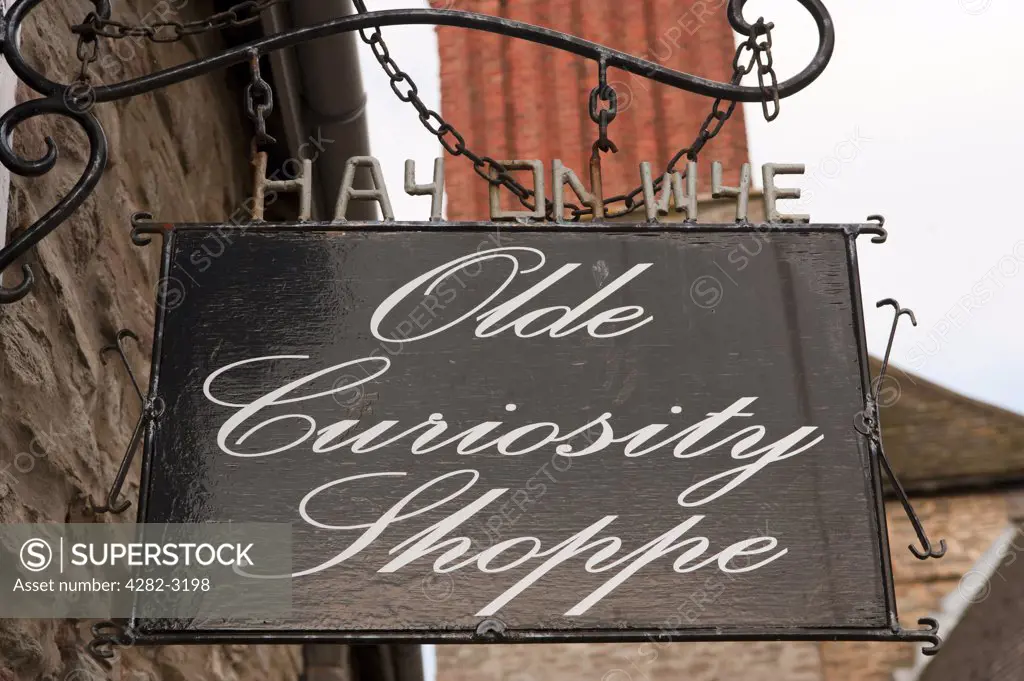 Wales, Powys, Hay-on-Wye. Olde Curiosity Shoppe sign in Hay-on-Wye.