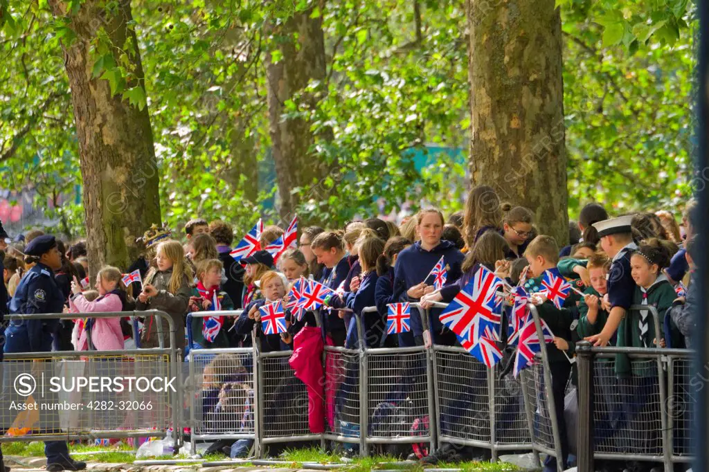 England, London, The Mall. Children waiting to see the Regiments of Guards at the Trooping of the Colour.