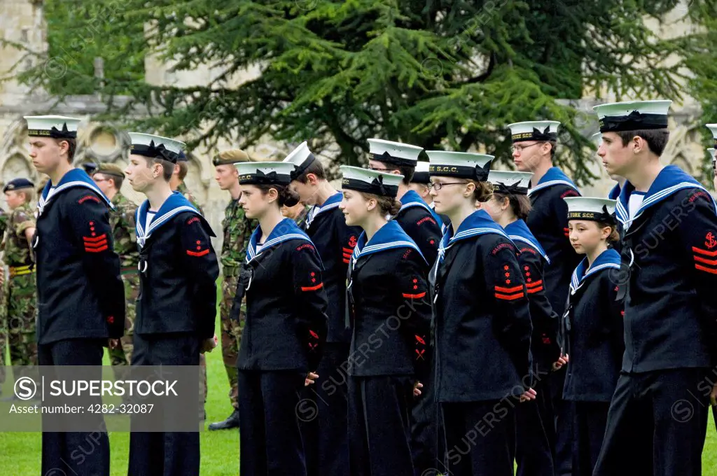 England, North Yorkshire, York. Members of the Sea Cadet Corps on parade at the Royal Salute for Coronation Day in Museum Gardens.