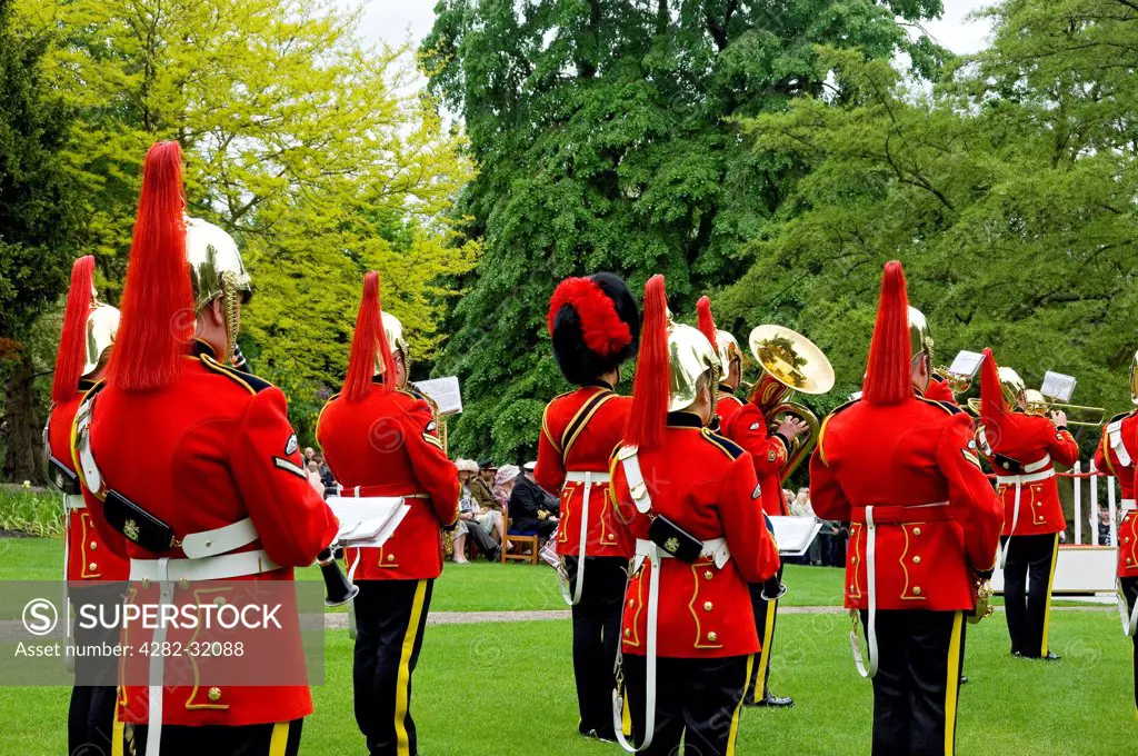 England, North Yorkshire, York. Heavy Cavalry and Cambrai Band at the Royal Salute for Coronation Day in Museum Gardens.