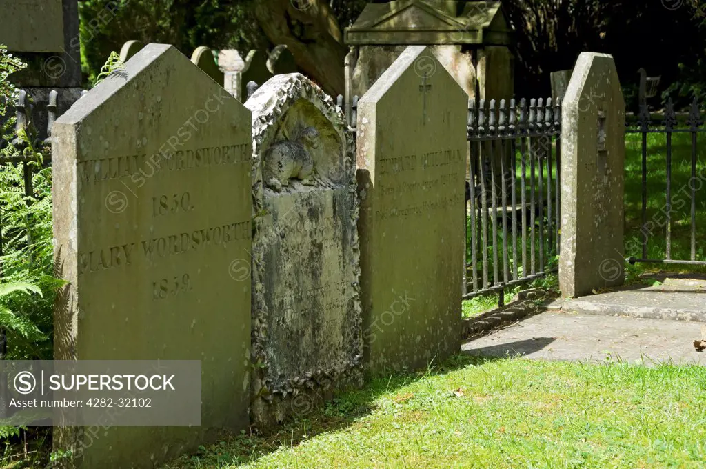 England, Cumbria, Grasmere. William and Mary Wordsworth's gravestones at St Oswald's Church in Grasmere.