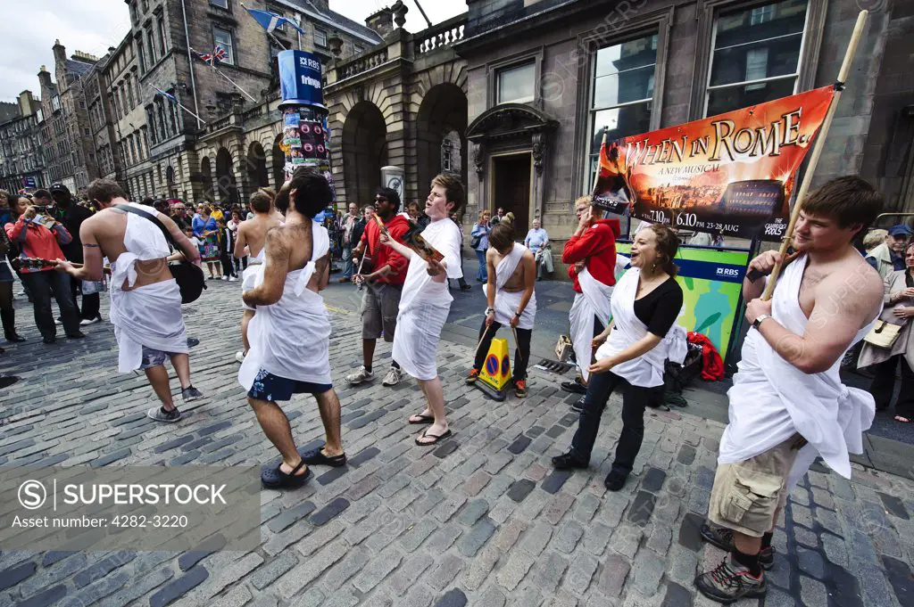 Scotland, City of Edinburgh, Edinburgh. A performance in the High Street as part of the Fringe at the Edinburgh Festival.
