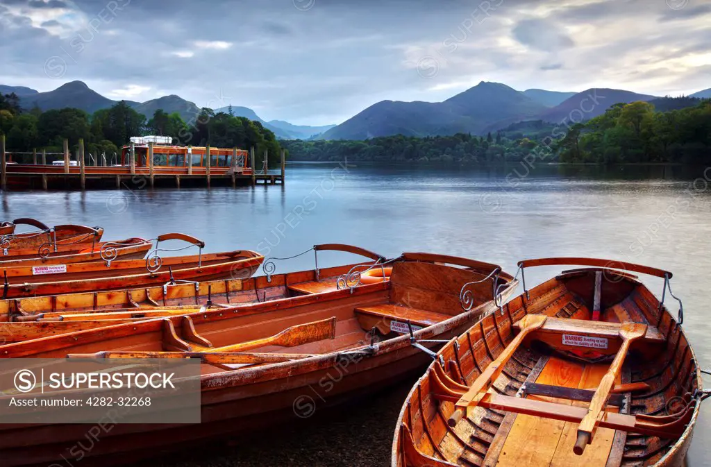 England, Cumbria, Derwent Water. Rowing boats on the edge of Derwent water.