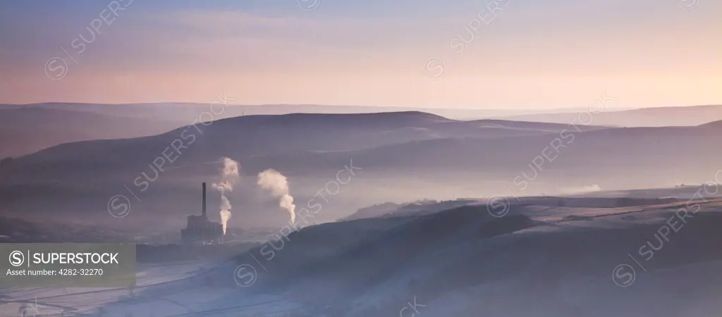 England, Peak District, Hope Valley. Hope Valley Cement Works shrouded in mist in the Peak District National Park.