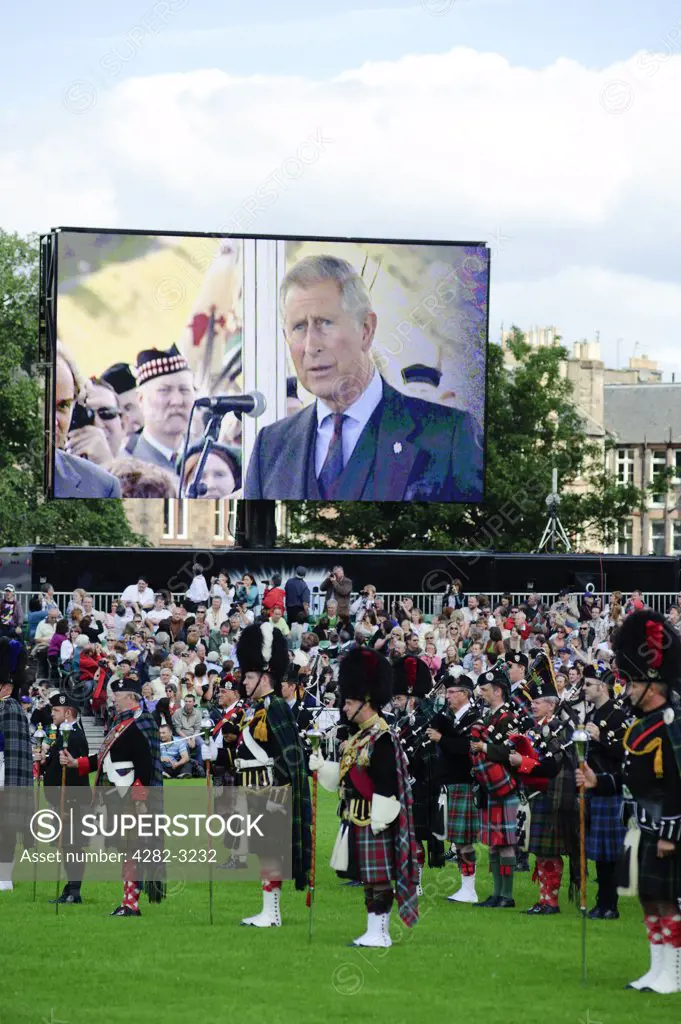 Scotland, City of Edinburgh, Edinburgh. The Prince of Wales on a large screen opening The Gathering 2009 in Holyrood Park. The two day event featured the largest Highland Games to be held in Scotland.