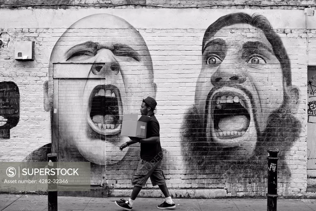 England, London, Hanbury Street. Hanbury Street art depicting extremes of intolerance.