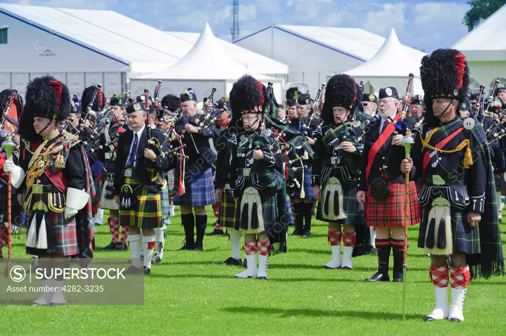 Scotland, City of Edinburgh, Edinburgh. Massed pipes in the arena at The Gathering 2009 in Holyrood Park.