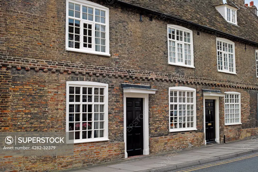 England, Cambridgeshire, Ely. Old terraced houses built of brick in Waterside.