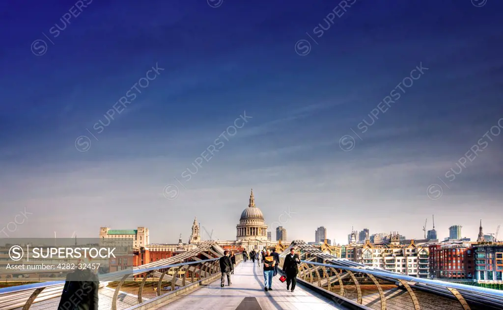 England, London, Millenium Bridge. A view across the Millenium Bridge with St Pauls Cathedral in the background