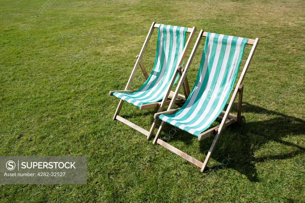 England, London, Hyde Park. Two deck chairs in Hyde Park.