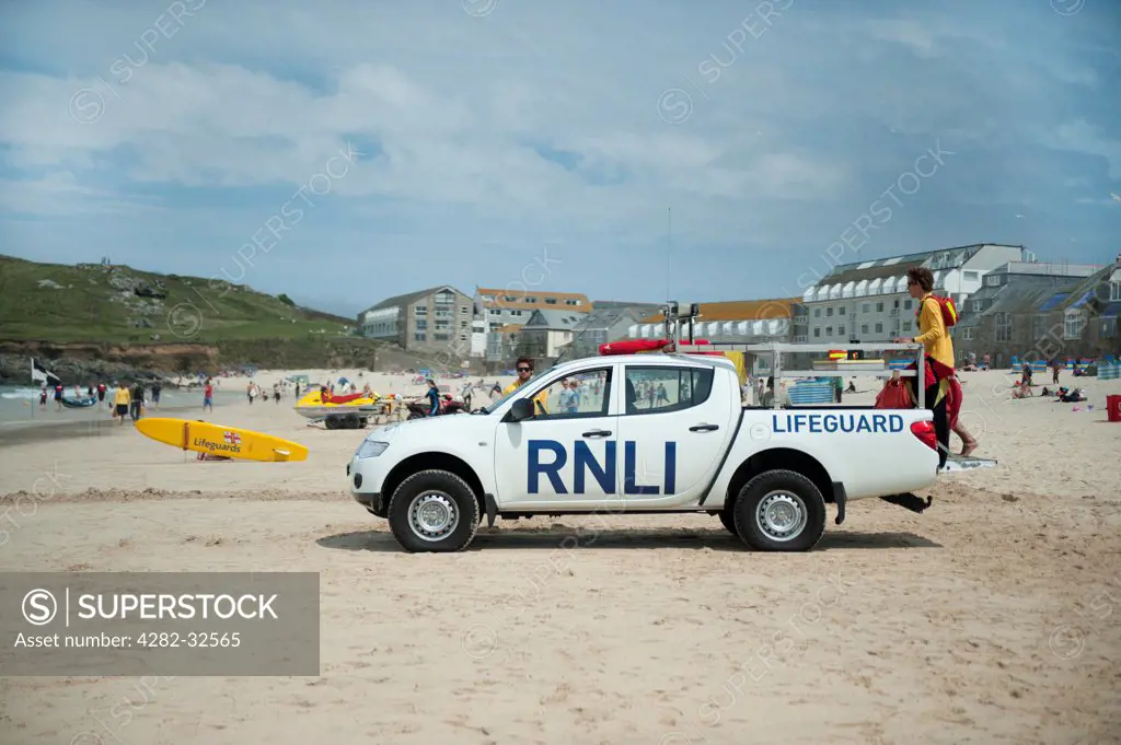 England, Cornwall, St Ives. RNLI Lifeguards on Porthmeor Beach in St Ives.