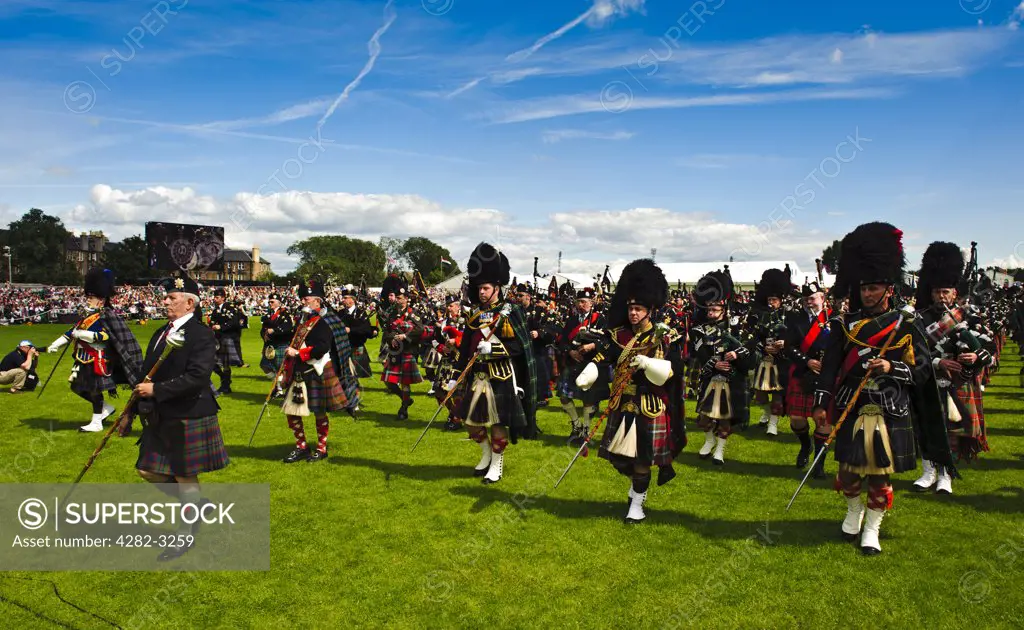 Scotland, City of Edinburgh, Edinburgh. Massed pipes perform in the arena at The Gathering 2009 in Holyrood Park.