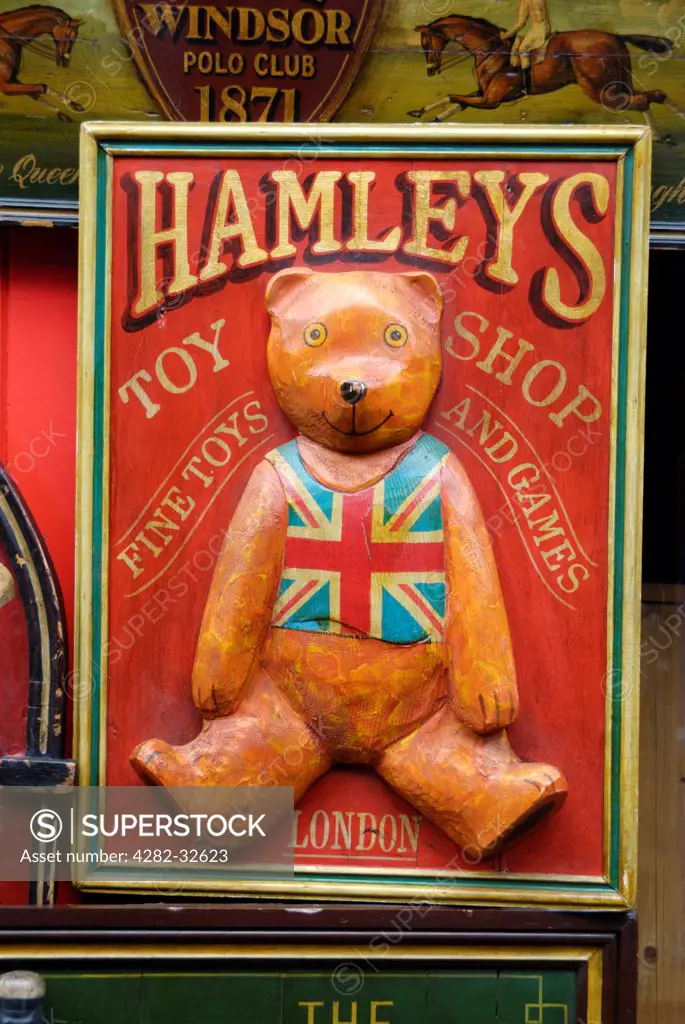 England, London, Portobello Road. An antique Hamleys toy shop sign for sale in Portobello market.