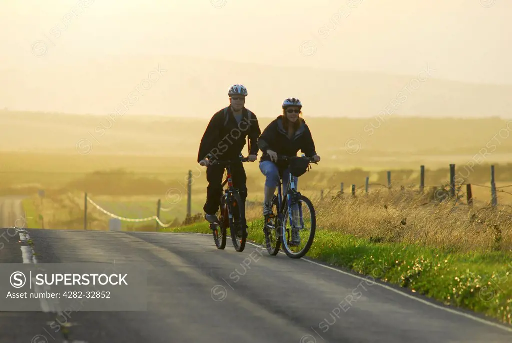 England, Hampshire, Isle of Wight. Cyclists on the Isle of Wight.