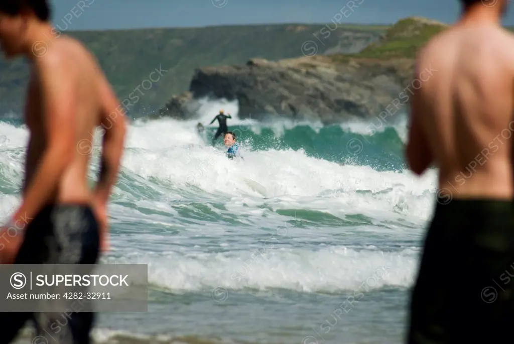England, Cornwall, Newquay. Surfers in Newquay.