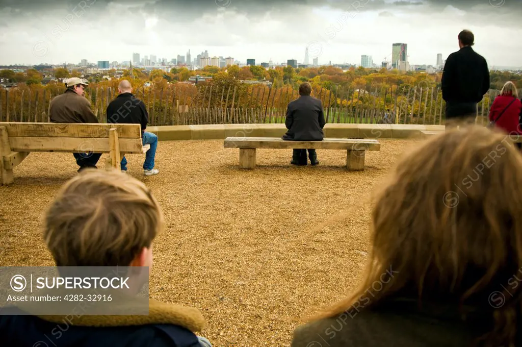 England, London, Primrose Hill. People looking at the view of London from Primrose Hill.
