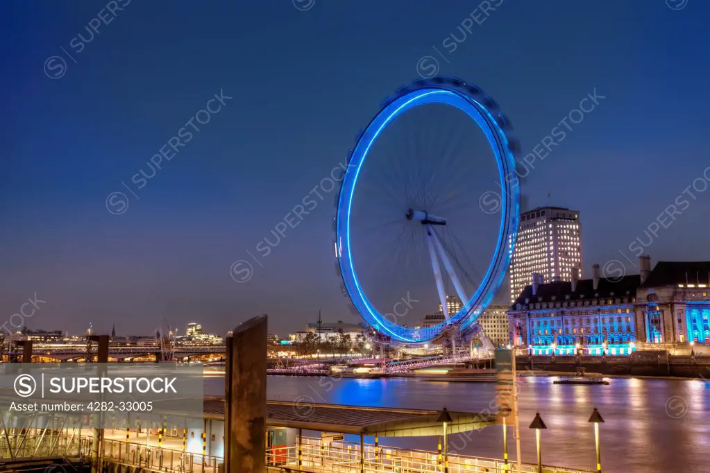 England, Westminster, London. A view of the London Eye at night.