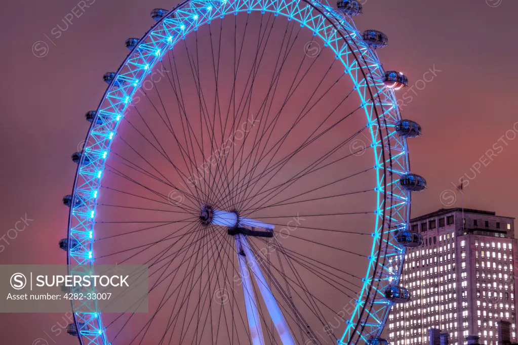 England, Westminster, London. A view of the London Eye at night.