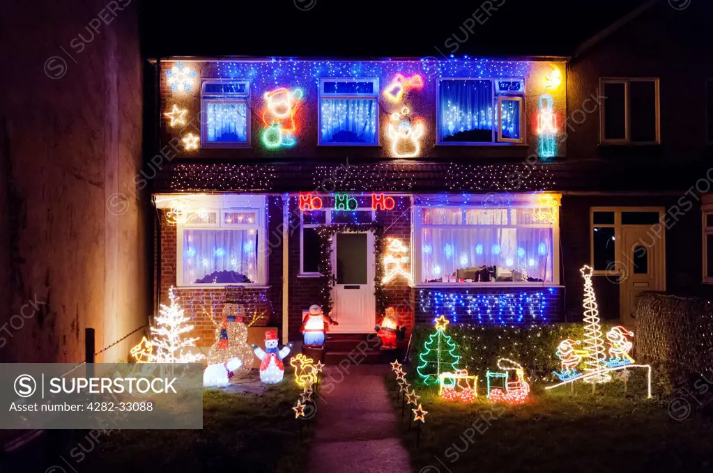 England, Essex, West Thurrock. Over the top and tacky Christmas decorations on a residential house in West Thurrock in Essex.
