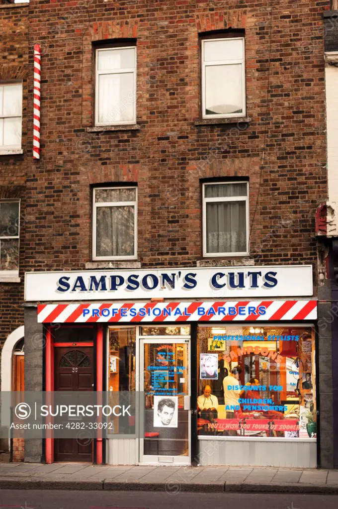 England, London, Islington. Exterior of Sampson's Cuts which is a local barbershop in Highbury.