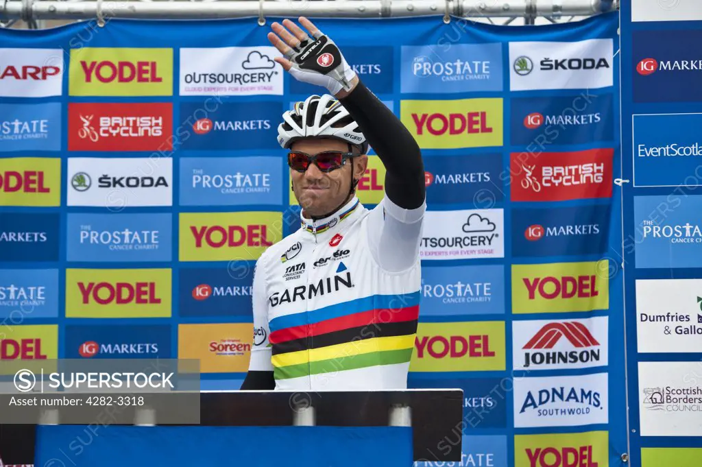 Scotland, Scottish Borders, Peebles. 2010 World Road Race Champion Thor Hushovd waves to spectators as he signs on for stage one of the 2011 Tour of Britain.