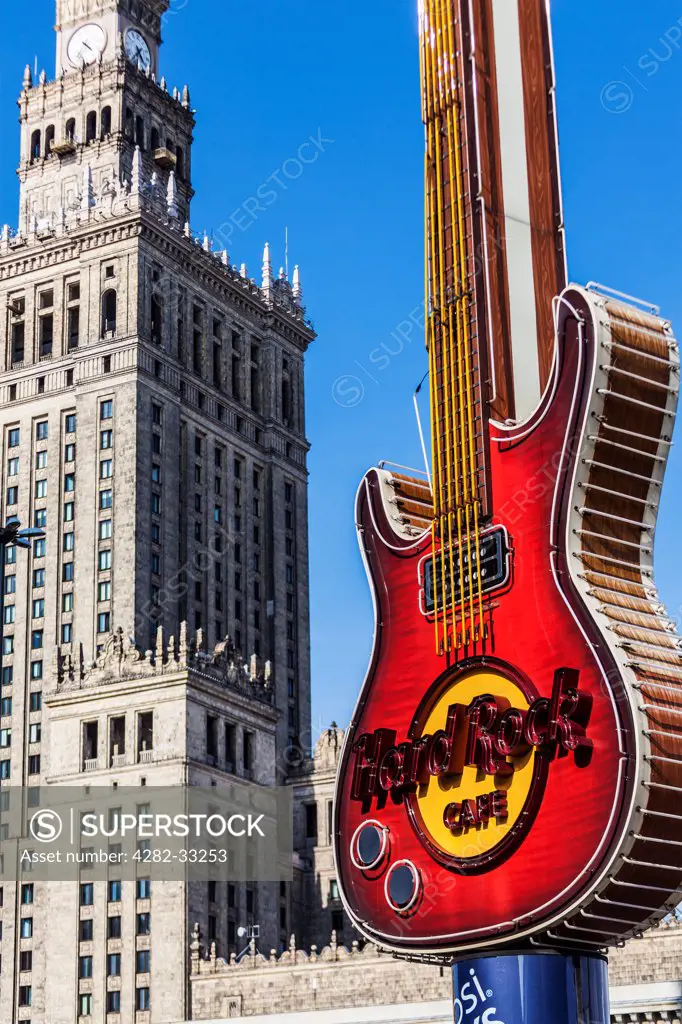 Poland, Mazovia Province, Warsaw. The Palace of Culture and Science and the Hard Rock Cafe guitar at Zlote Tarasy in Warsaw.