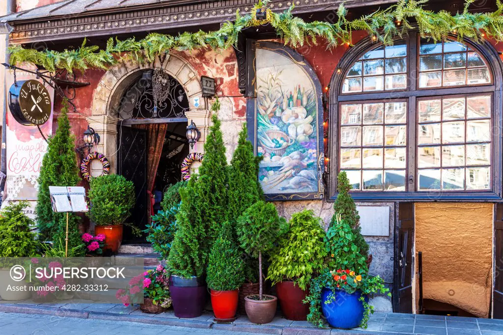 Poland, Mazovia Province, Warsaw. The front entrance of the famous Polish restaurant U Fukiera in Stary Rynek in Warsaw.