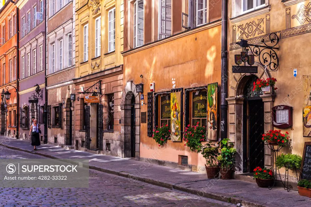 Poland, Mazovia Province, Warsaw. A small cobbled street in the historic district of Stare Miasto in Warsaw.