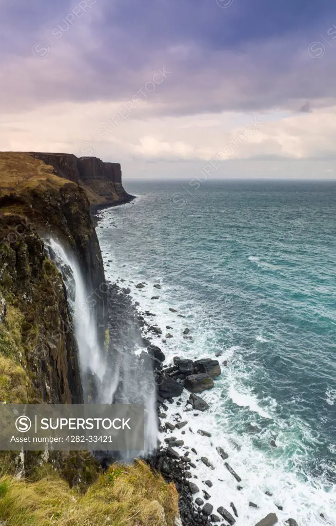 Scotland, Isle of Skye, Portree. Mealt Waterfall with Kilt Rock in the distance.