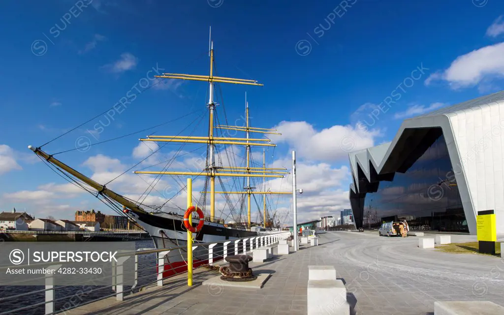 Scotland, Lowlands, Glasgow. Rear of Glasgow Riverside Museum and the tall ship Glenlee moored in the Clyde.